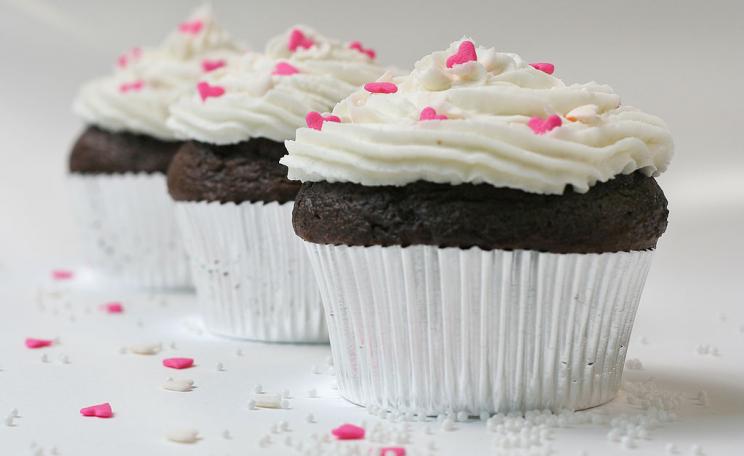 Chocolate cupcakes with sugar hearts and nonpareils