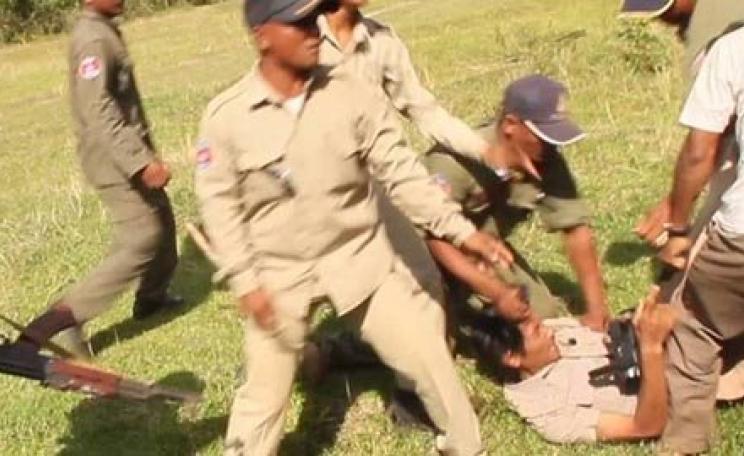 Chut Wutty under attack by military personnel in Cambodia after burning a store of illegal timber. Five months later, he was murdered by persons unknown at a logging camp in the Cardomom mountains. Photo: Fran Lambrick.