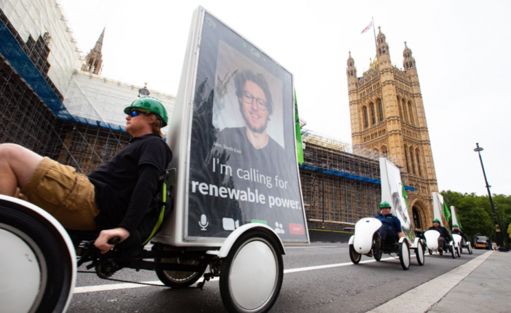 Keeping to COVID-19 social distancing rules, 7 bikes carrying ad screens with huge faces of people attending virtually cycled across Westminster Bridge and parked up near Parliament Square to bring the people to Parliament with their asks for MPs. 