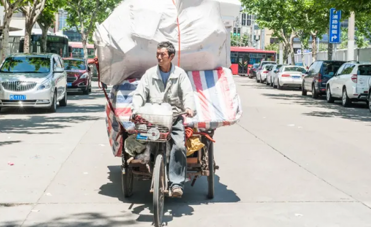 waste recycler on bike in China